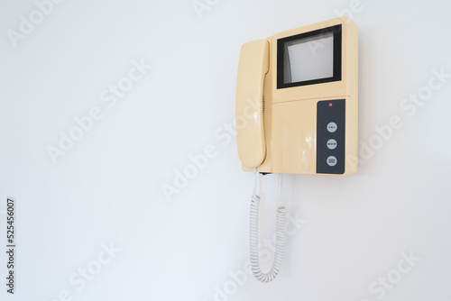 Intercom control on the wall in modern apartment.