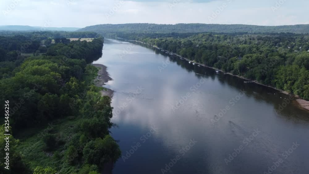 Flying over the Delaware river on a sunny cloudy day Flying over the Delaware river on a sunny cloudy day