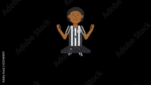 Black male US referee meditating in crossed legged position also known as the lotus position photo