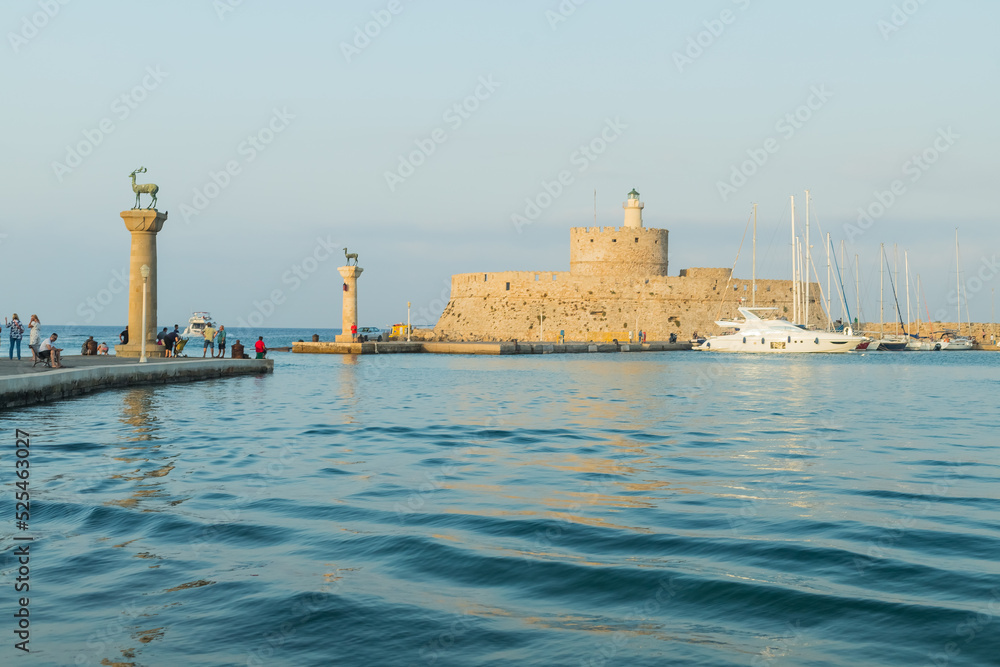 Fort of St. Nicholas in Mandaki Harbor, Rhodes, Greece.the famous deers, one of the island's symbols.Greece. View of famous tourist destination