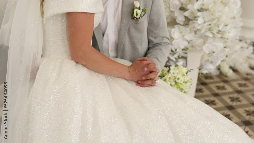 bride and groom hold hands at the wedding bride and groom hold hands at the wedding
