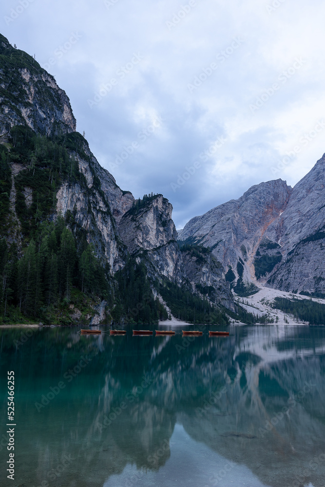 lake in the mountains with red boats Lago di braies Dolomites lake in the mountains with red boats Lago di braies Dolomites