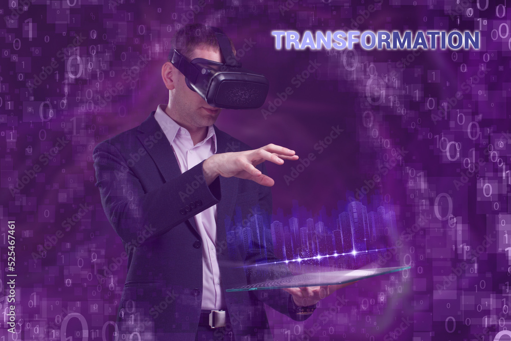 Business, Technology, Internet and network concept. Young businessman working on a virtual screen of the future and sees the inscription: Transformation Business, Technology, Internet and network concept. Young businessman working on a virtual screen of the future and sees the inscription: Transformation