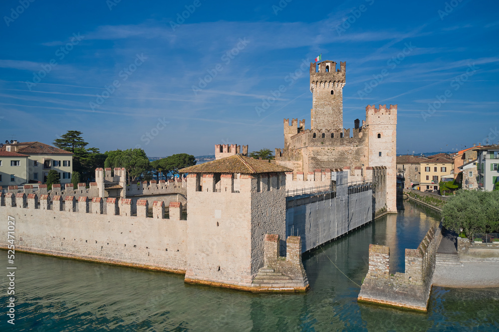 Scaligero Castle drone view. Sirmione top view. Aerial photography with drone, Rocca Scaligera Castle in Sirmione. Garda, Italy. Popular travel destination on Lake Garda in Italy.