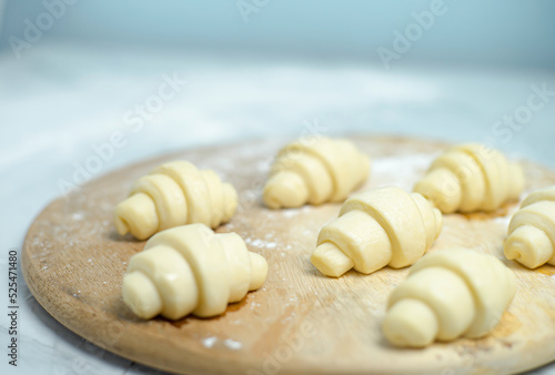 An image selected focus preparation croissant for waffles on the wood table in a homemade cooking for cuisine or breakfast with copy space for text.