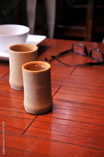 Bamboo cups with tea on the table  © 曹宇