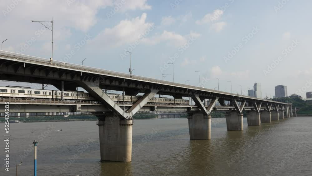 Seoul Subway Train Crossing Hangang river on Cheongdam Bridge on Sunny Day Seoul Subway Train Crossing Hangang river on Cheongdam Bridge on Sunny Day