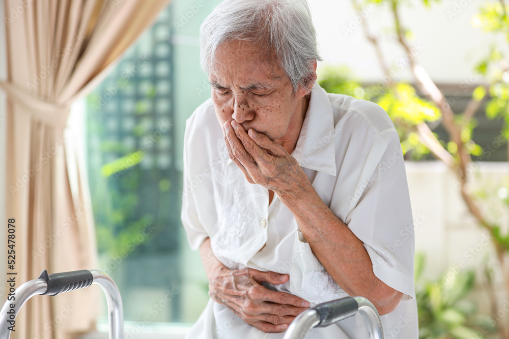 Asian senior woman suffering from abdominal bloating,colic in abdomen