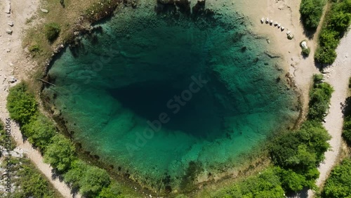 Karst Spring Flowing Into Cetina River On A Sunny Day In Croatia. - aerial ascend