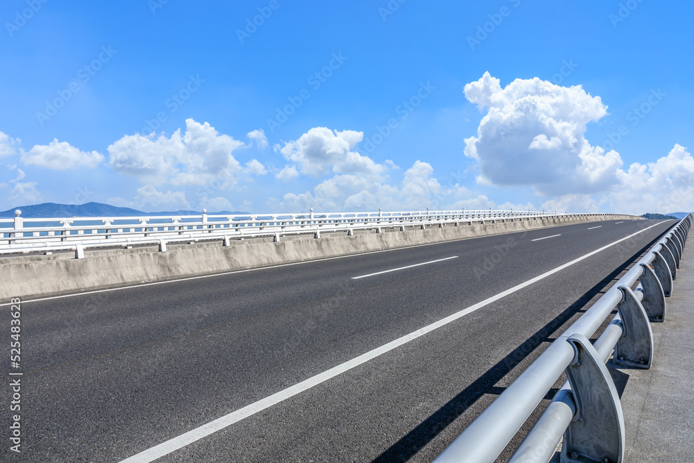 Fototapeta premium Empty asphalt road and sky cloud background