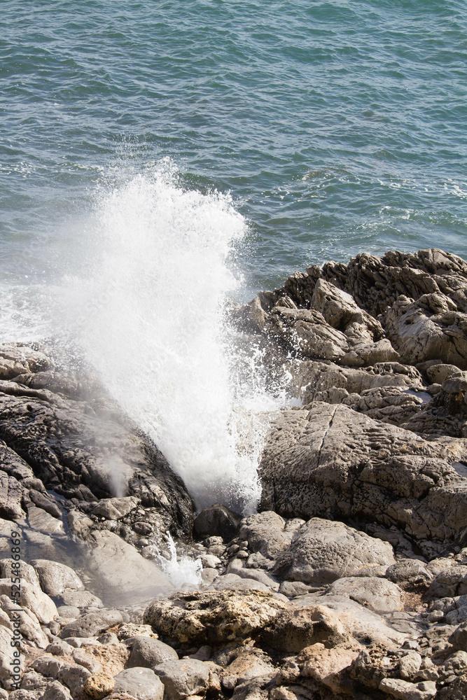 evocative image of a rough sea hitting the rocks in Sicily evocative image of a rough sea hitting the rocks in Sicily