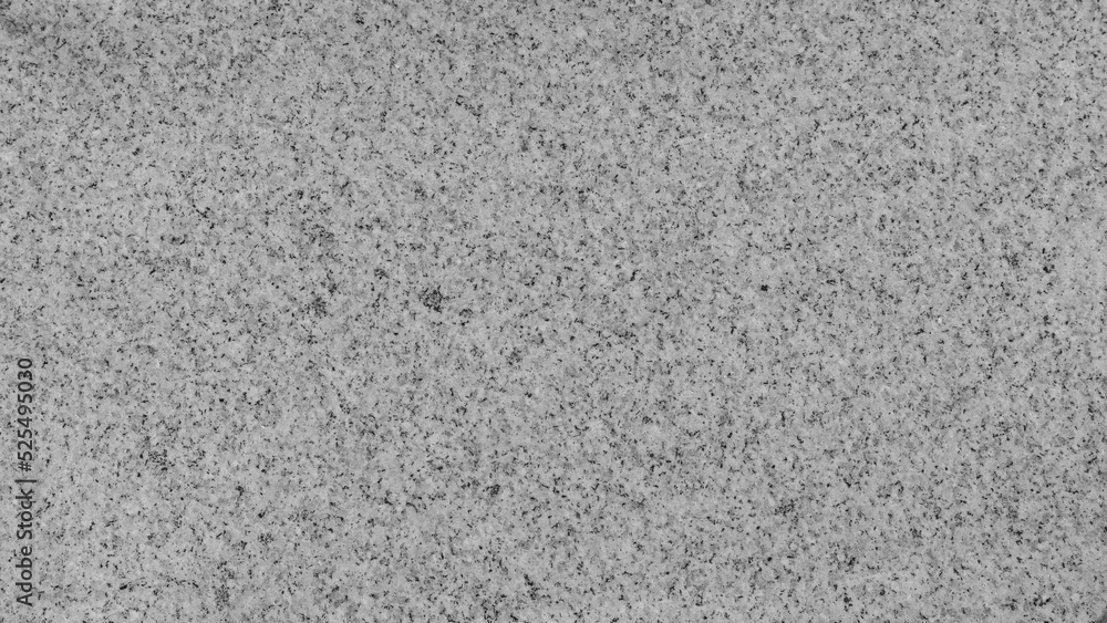 Fototapeta premium The texture of white stone with black inclusions and dots.