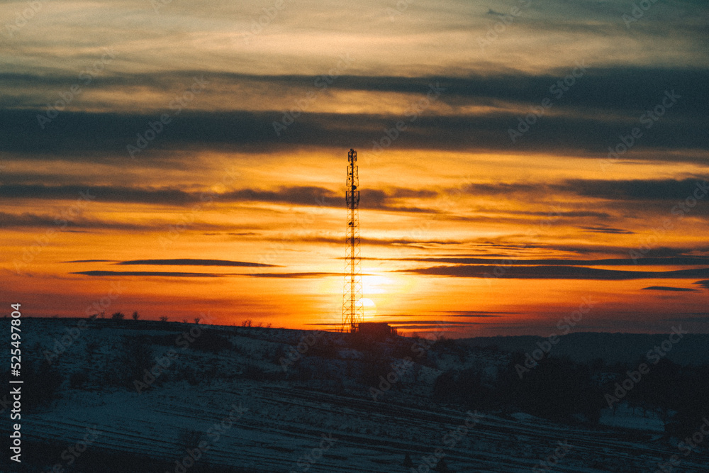 Obraz premium sunset over winter snowed field