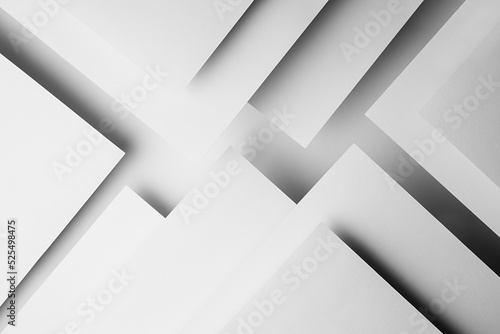 Fotografie White abstract geometric background with white paper sheets soar as abstract spaces in glow with triangles, corners, stripes, perspective and shadows in simple strict modern style for business