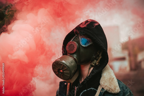 Person holding smoke bomb on street photo