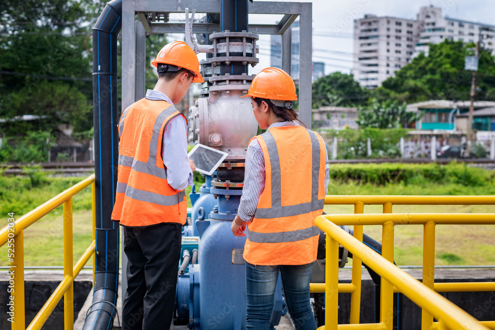 Worker under checking the waste water treatment pond industry large to control water support industry. Worker under checking the waste water treatment pond industry large to control water support industry.