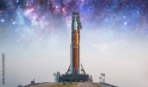 Spaceship on launch pad. Mission to Moon. Return to Moon. SLS space rocket. Orion spacecraft. Aretmis spae program to research solar system. Elements of this image furnished by NASA
