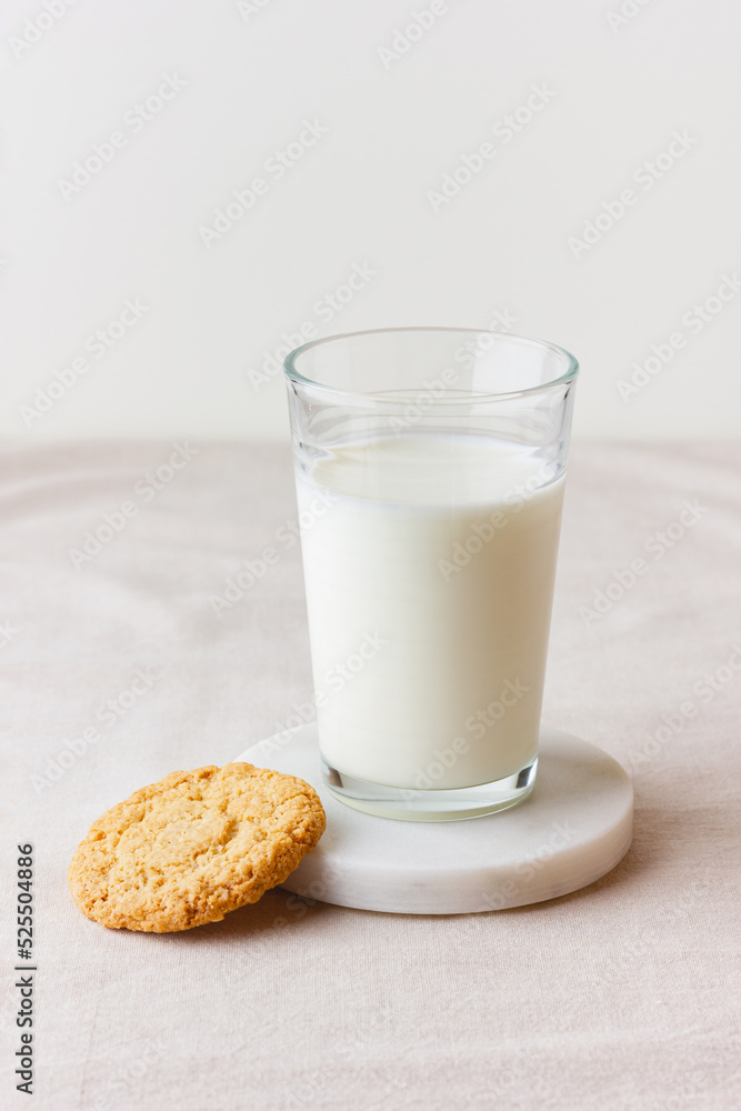 Glass of fresh milk with oatmeal cookie Glass of fresh milk with oatmeal cookie