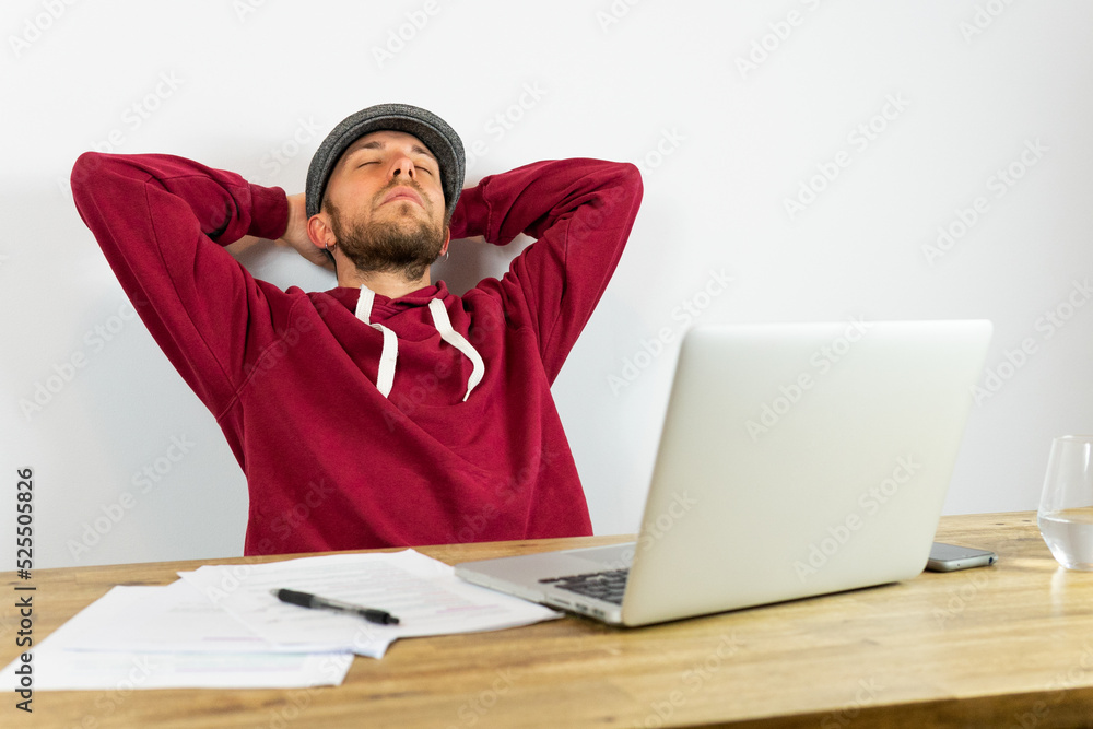 Man at table with laptop Man at table with laptop