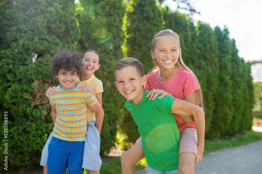 Fototapeta premium Younger friends spending time actively summer holidays