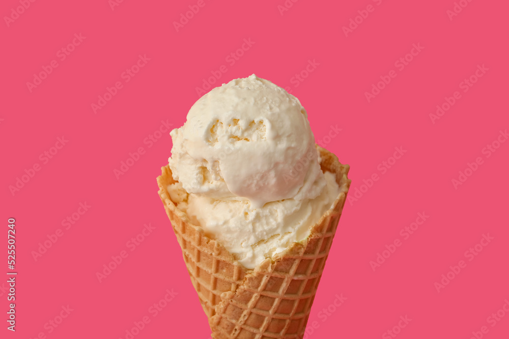 Delicious ice cream in waffle cone on pink background, closeup Delicious ice cream in waffle cone on pink background, closeup