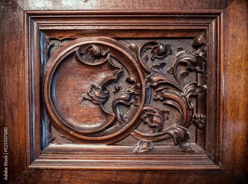 Close-up of a fragment of old antique wood furniture. Antique furniture from the 19th century.