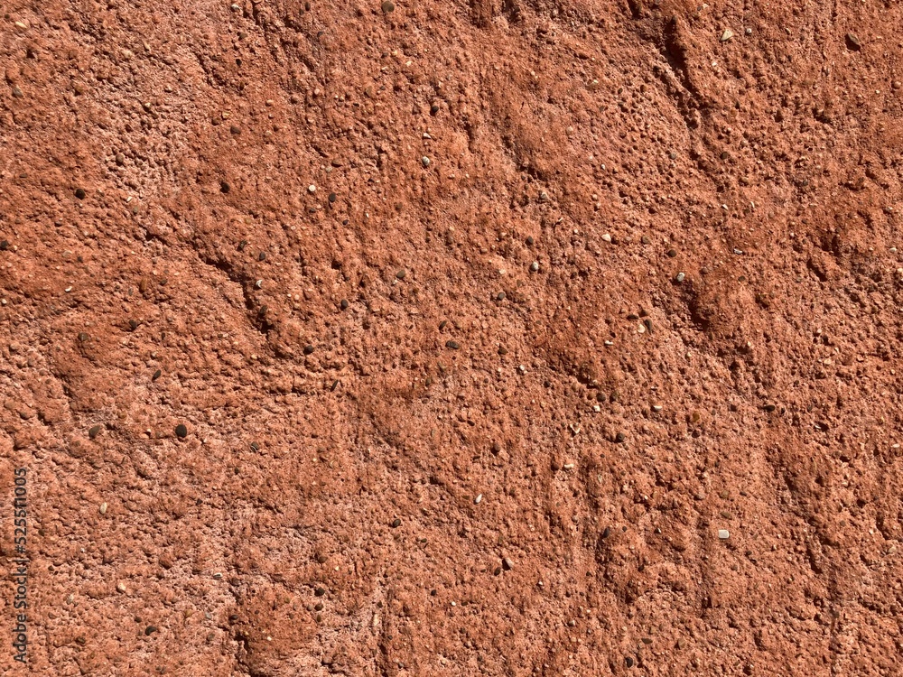 Close up of irregular patterned surface of red and brown sandstone