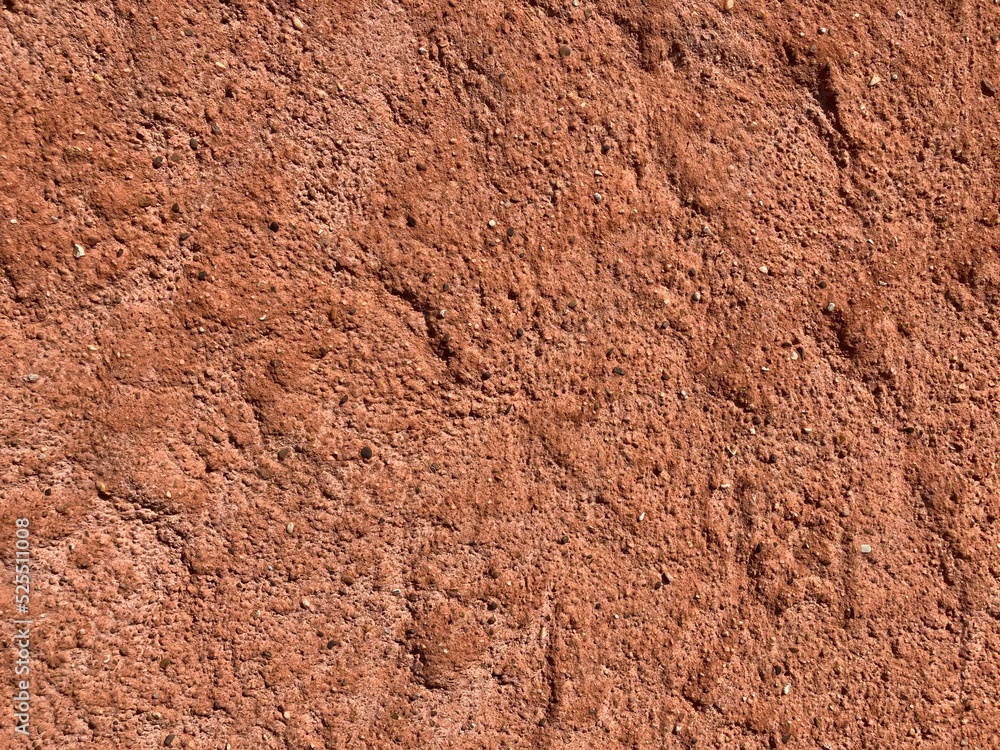 Close up of irregular patterned surface of red and brown sandstone