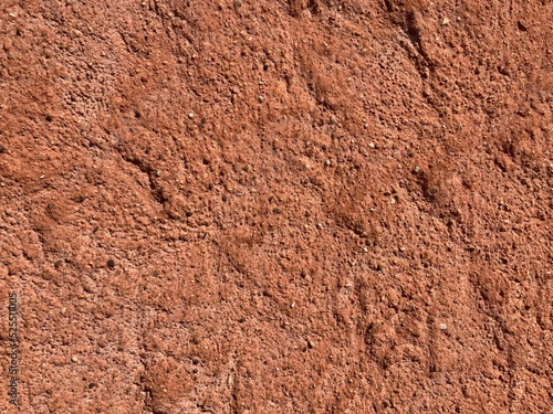 Close up of irregular patterned surface of red and brown sandstone
