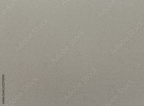 Abstract paper background. Horizontal vintage grey craft paper texture close up.