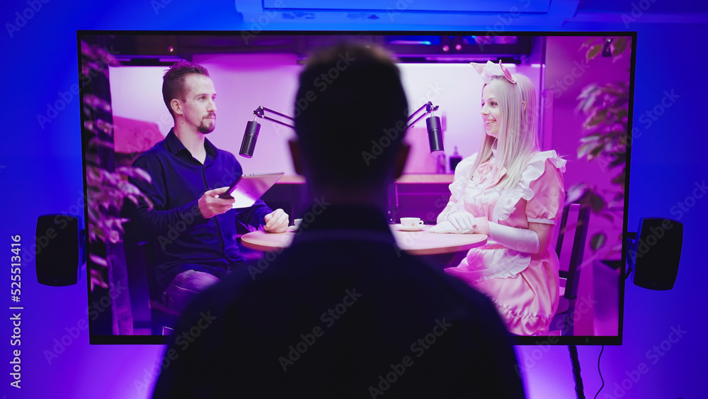 Anime fan male person silhouette watch video podcast on big TV screen Anime fan male person silhouette watch video podcast on big TV screen