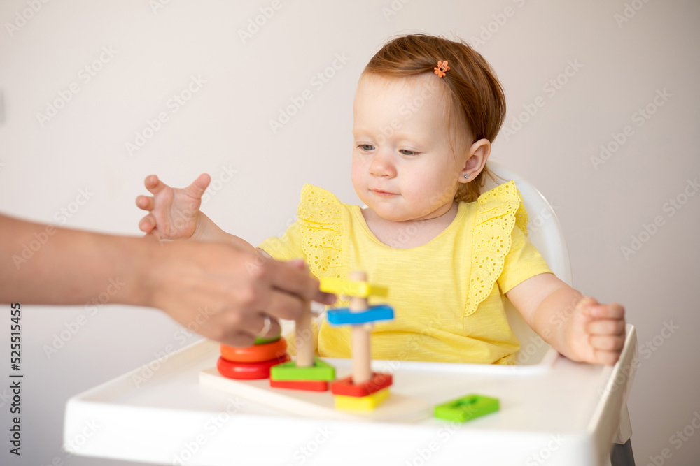 Emotional cute Baby is playing. Infant learning and development. Wooden eco-friendly educational toys. Montessori system. Emotional cute Baby is playing. Infant learning and development. Wooden eco-friendly educational toys. Montessori system.