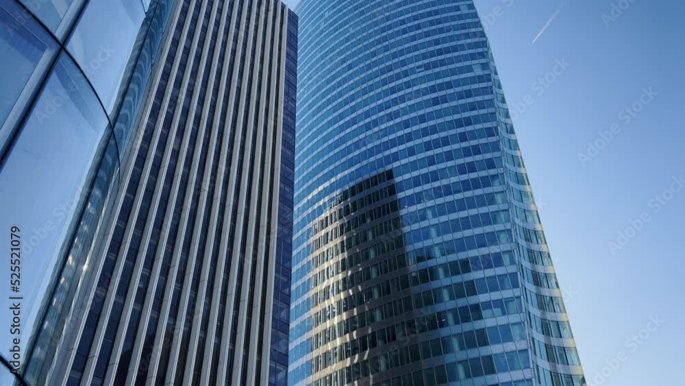 Modern office high rise skyscraper buildings. City business district. Looking up at business buildings. Low angle view of business buildings. Paris France Modern office high rise skyscraper buildings. City business district. Looking up at business buildings. Low angle view of business buildings. Paris France