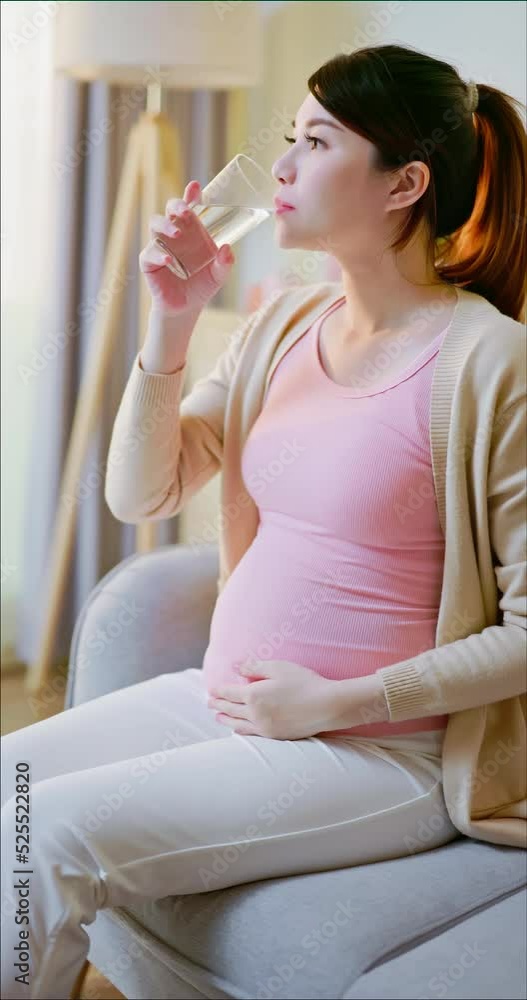 Asian pregnant woman take vitamin Asian pregnant woman take vitamin