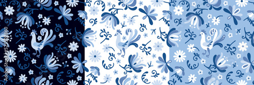 Set of seamless patterns with stylized ukrainian folk floral and animal elements on blue background. Ethnic ornament based on embroidery tradition. Can be used for decoration, surface and print design