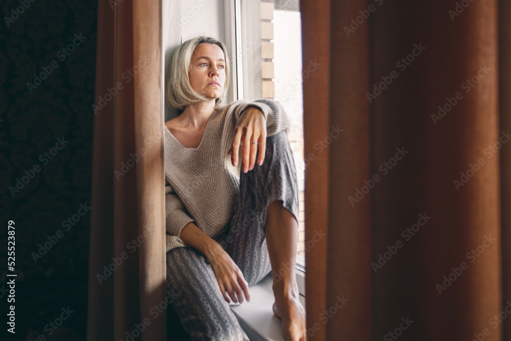 © Tatyana Gladskih - Sad pensive adult 40s woman at home