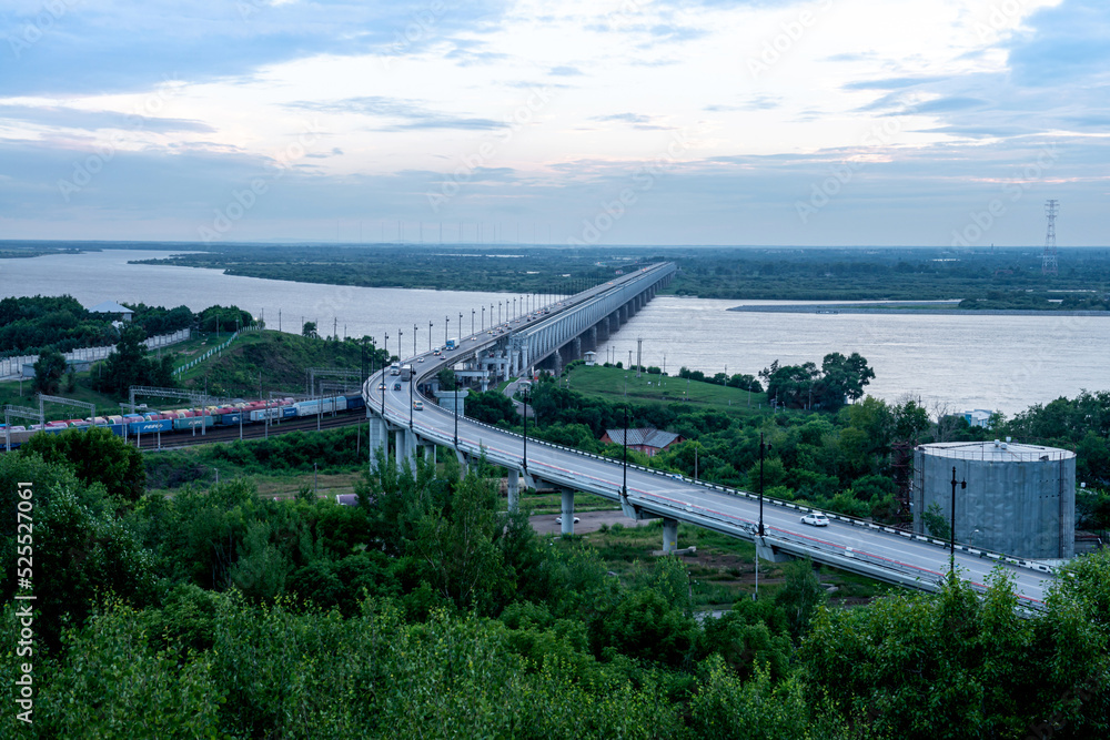 Summer landscape: bridge over the Amur River near the city of Khabarovsk in the evening