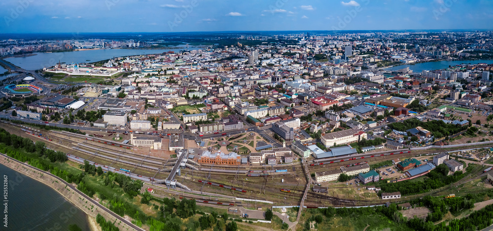 Panoramic view of the entire center of Kazan. You can see the railway station, the Kremlin and other sights of the city. The Volga and Kazanka Rivers, Kaban Lake. An unusual view of Kazan from above.