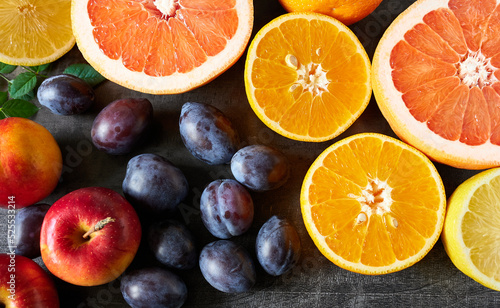 Fruits citrus and fruit - berry close-ups  top view. Beautiful wallpaper.