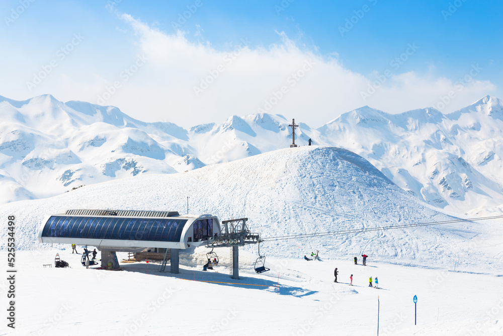 Skiers on ski lift at Vogel, Slovenia.