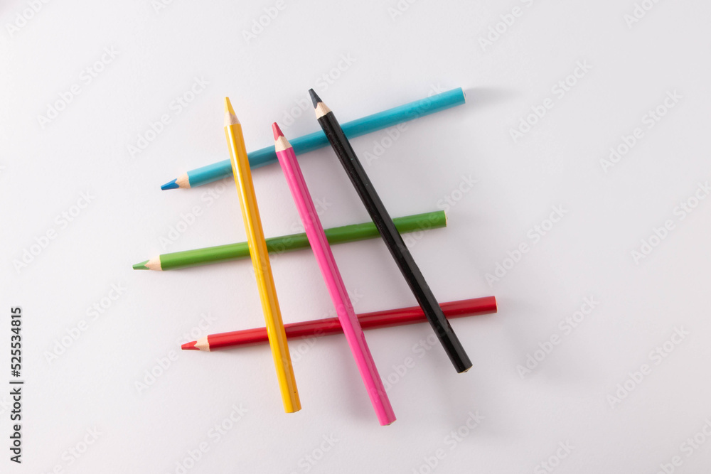 Colored wooden pencils on gray background, minimal back to school concept
