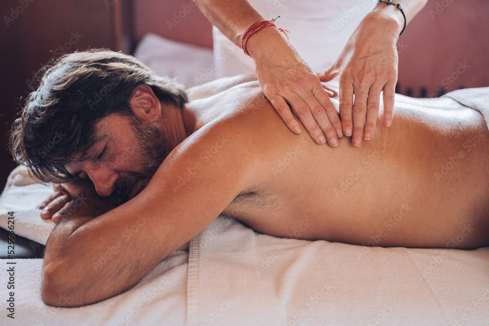 anonymous Masseuse working with back of man anonymous Masseuse working with back of man