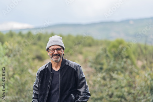 Portrait of a middle-aged man with winter hat looking at camera photo