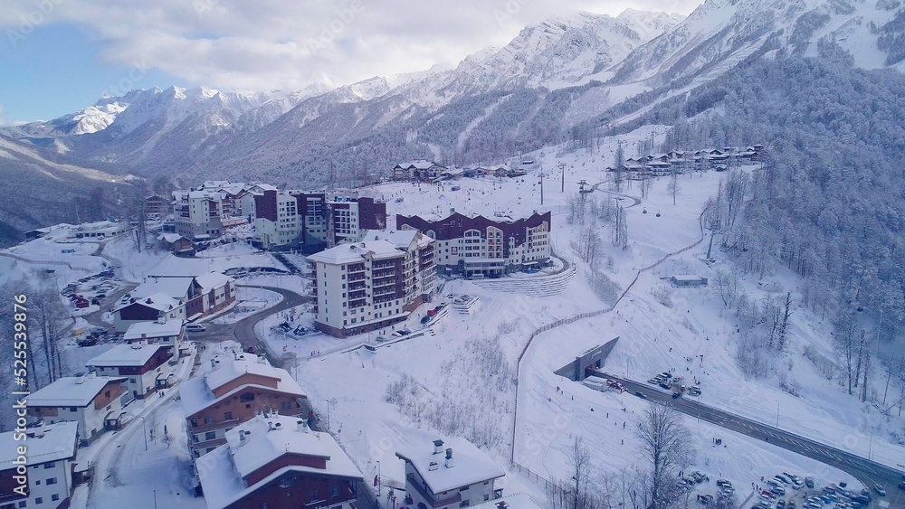 Hotels and ski lift on site of former Olympic village of Rosa Plateau at altitude of 1170 m from sea level. Krasnaya Polyana, Sochi, Russia