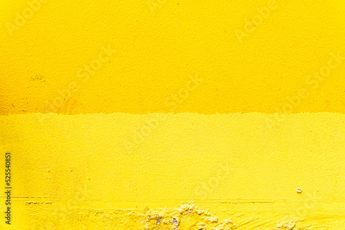 Obraz na płótnie Yellow background, damaged wall, energetic colors, summer texture. w salonie