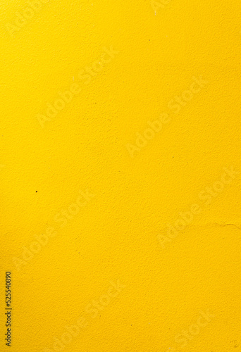 Obraz na płótnie Yellow background, damaged wall, energetic colors, summer texture. w salonie