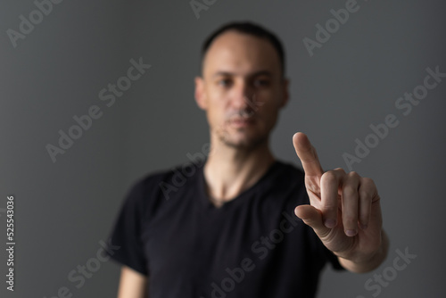 man points his finger at you. © Angelov