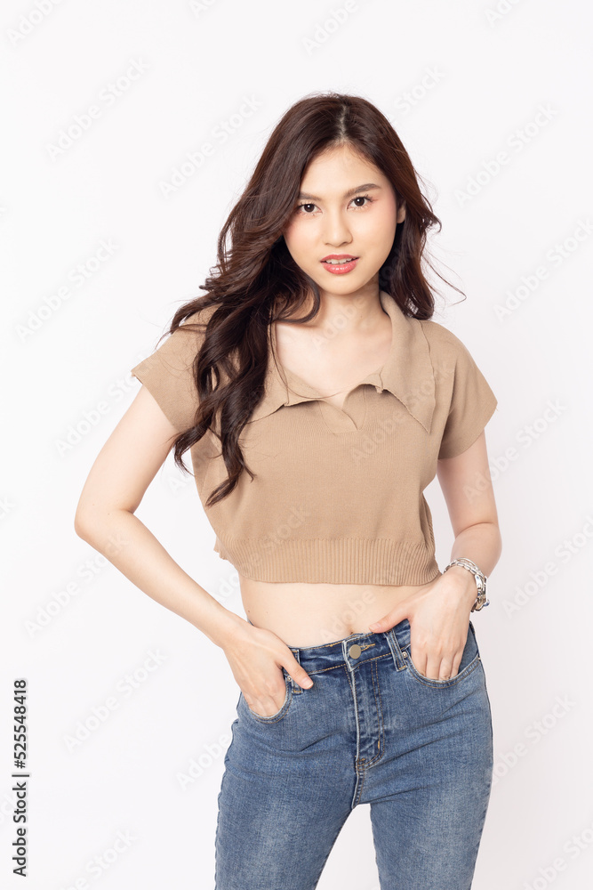 Obraz premium portrait Asian woman wearing brown shirt and jeans on white background