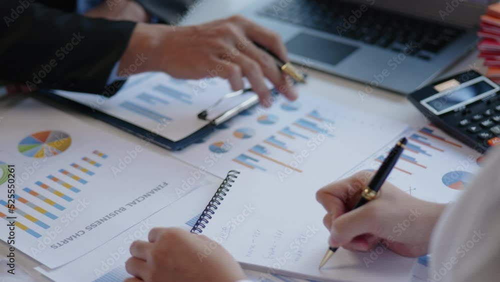 Close up of hands are working and brainstorming on paperworks about business financial and marketing. Close up of hands are working and brainstorming on paperworks about business financial and marketing.