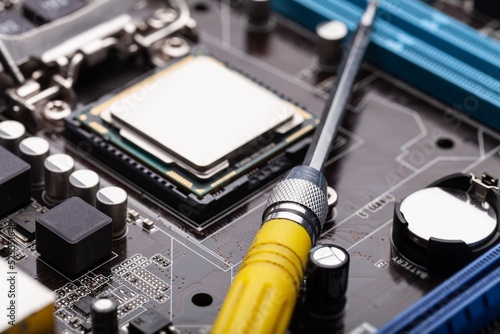 Engineering for repair and maintenance of digital technology. PC computer chip on the motherboard or circuit plate